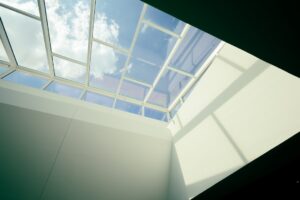 skylights reducing energy use from lighting in a bright modern living room - how skylights reduce energy use from lighting