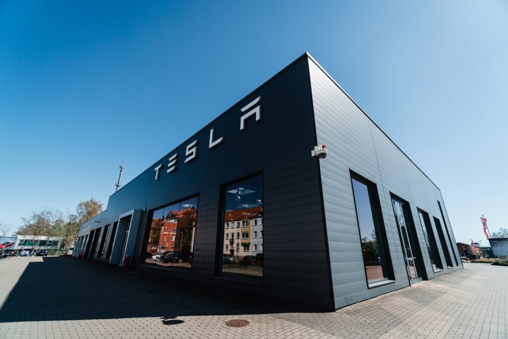 Tesla Solar Roof on a modern home with sunlight hitting solar tiles