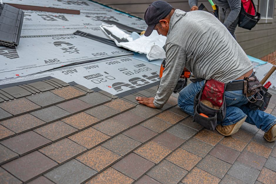 GAF master elite certified roofing contractor installing shingles on a residential home